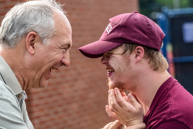 photos of two men smiling